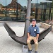 George Curtis rests on the anchor from the ironclad Merrimac